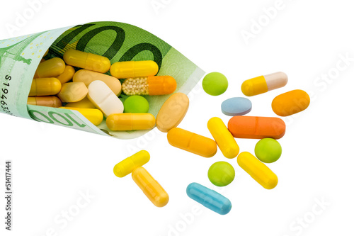Photo: Tabletten und Einhundert Euroschein Tabletten und Einhundert Euroschein