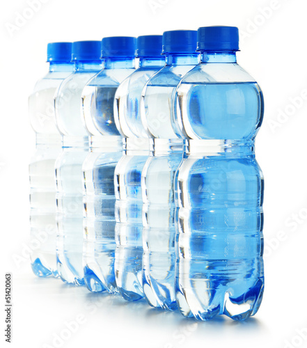Photo: Composition with empty polycarbonate plastic bottles of mineral Composition with empty polycarbonate plastic bottles of mineral