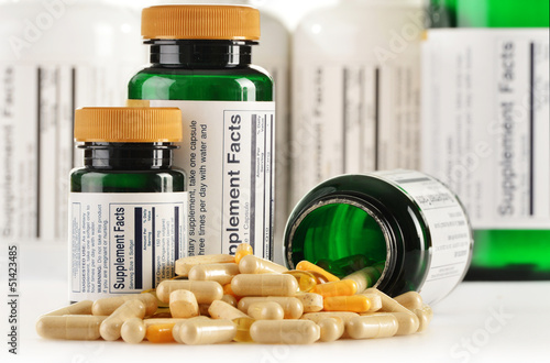 Photo: Composition with dietary supplement capsules. Drug pills Composition with dietary supplement capsules. Drug pills