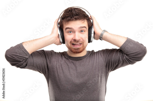 Photo: surprised young man in headphone surprised young man in headphone