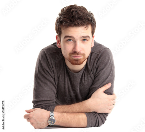 Photo: Man lying on floor with arms crossed Man lying on floor with arms crossed