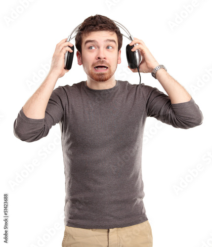 Photo: surprised young man in headphone surprised young man in headphone