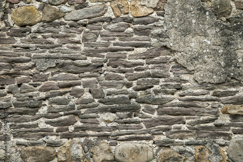 Photo: Stone Wall Background with rocks and concrete. Stone Wall Background with rocks and concrete.