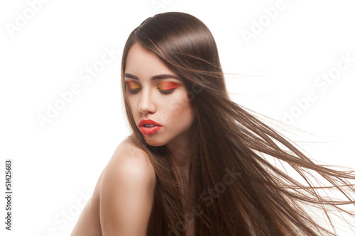 Photo: woman with long brown hairs and red lips woman with long brown hairs and red lips