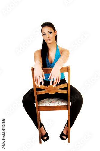 Photo: Girl sitting on chair. Girl sitting on chair.