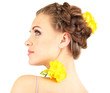 Young woman with beautiful hairstyle and flowers, isolated