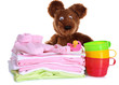 Pile of baby clothes isolated on white