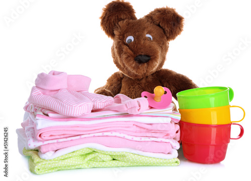 Photo: Pile of baby clothes isolated on white Pile of baby clothes isolated on white