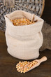 Beans in sack on wooden background