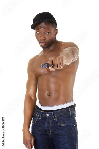 Photo: Afro american man standing with gun in hand. Afro american man standing with gun in hand.