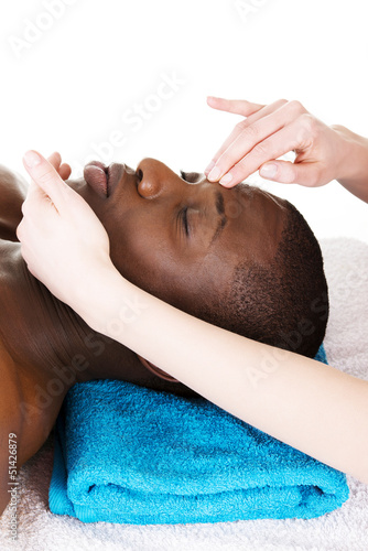Photo: Black man recaiving head massage at spa. Black man recaiving head massage at spa.
