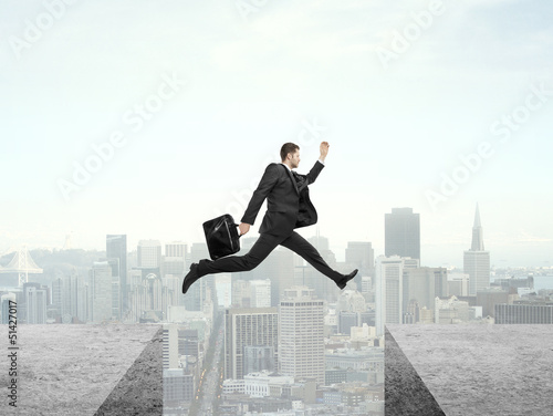 Photo: man jumping on roof man jumping on roof
