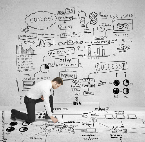 Photo: man drawing plan man drawing plan