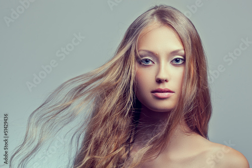 Photo: woman face portrait with flying hair woman face portrait with flying hair