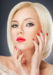 Photo: Blonde woman with bright red lips and manicure Blonde woman with bright red lips and manicure