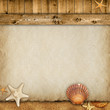 Summer background - paper sheet, planks, sand and shells
