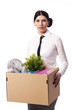 Businesswoman holding a box of personal items