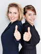 Female apprentices for office having thumbs up