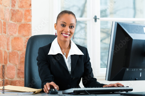Photo: Lawyer in office sitting on the computer Lawyer in office sitting on the computer