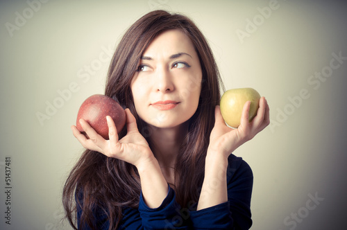 Photo: beautiful woman with red and yellow apples beautiful woman with red and yellow apples
