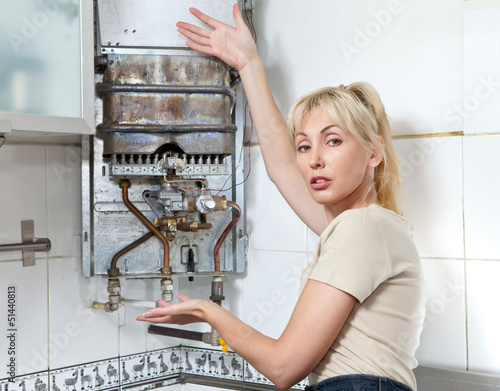 Photo: The housewife is upset, the gas water heater has broken The housewife is upset, the gas water heater has broken