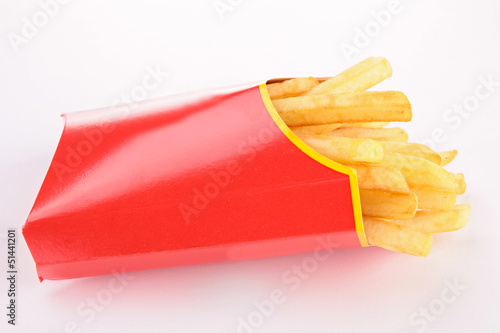 Photo: french fries in paper bag isolated on white french fries in paper bag isolated on white