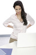 Photo: Woman with back pain at desk Woman with back pain at desk