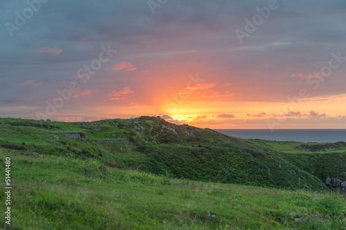 Photo: Sunset behind hills Sunset behind hills