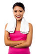 Photo: Fit smiling woman with towel around her neck Fit smiling woman with towel around her neck
