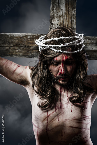 Photo: Jesus Christ with crown of thorns white on the cross of Calvary Jesus Christ with crown of thorns white on the cross of Calvary
