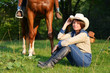 Beautiful Smiling Cowgirl with horse