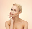 woman touching her face