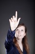 Woman's hand with finger, dark background