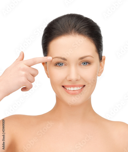 Photo: woman touching her face skin woman touching her face skin