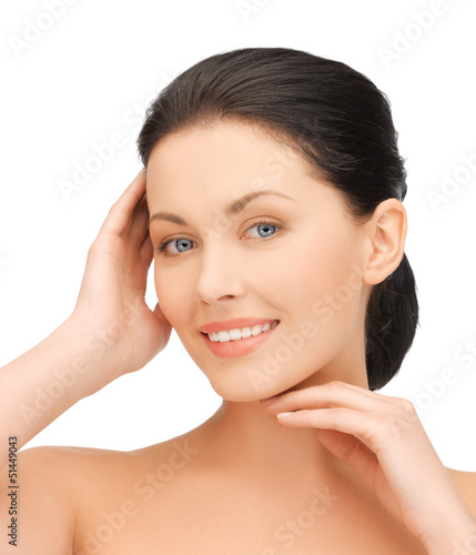 Photo: woman touching her face woman touching her face