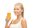 woman holding glass of orange juice