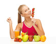woman with organic food eating strawberry