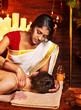 Woman having Ayurvedic spa treatment.