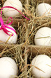 Decorative Easter eggs in wooden basket close up