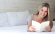Happy woman reading a book