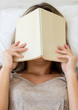 Frustrated woman reading a book