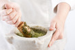 Cook preparing pesto