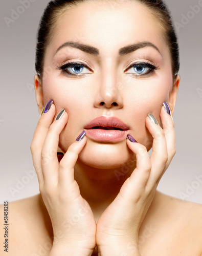 Photo: Beauty Portrait. Beautiful Spa Woman Touching her Face Beauty Portrait. Beautiful Spa Woman Touching her Face