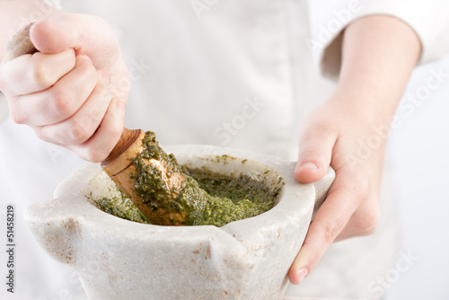 Photo: Cook preparing pesto Cook preparing pesto