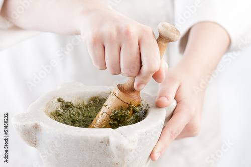 Photo: Cook preparing pesto Cook preparing pesto