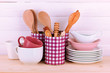 Cups, bowls nd other utensils in metal containers isolated