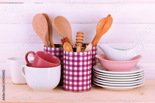 Photo: Cups, bowls nd other utensils in metal containers isolated Cups, bowls nd other utensils in metal containers isolated