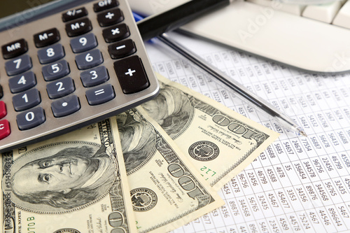 Photo: Financial information and money close-up Financial information and money close-up