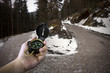 lost man holding compass with two paths to choose from