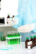Scientist conducting research in laboratory close up